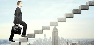 A businessman walks up a staircase above a city.